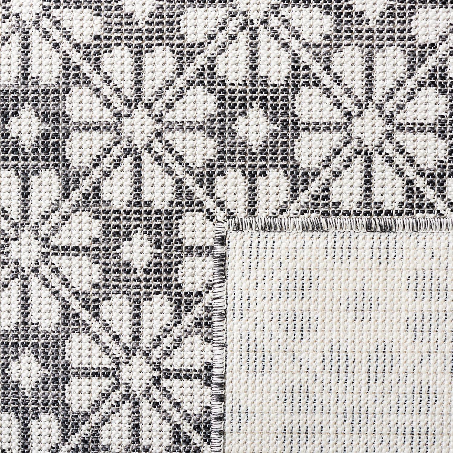 imageMartha Stewart x SAFAVIEH Outdoor Area Rug Collection 8 x 10 Black Weather Resistant amp Washable Ideal for Patio Backyard Mudroom Deck Dining Space MSR4491Z