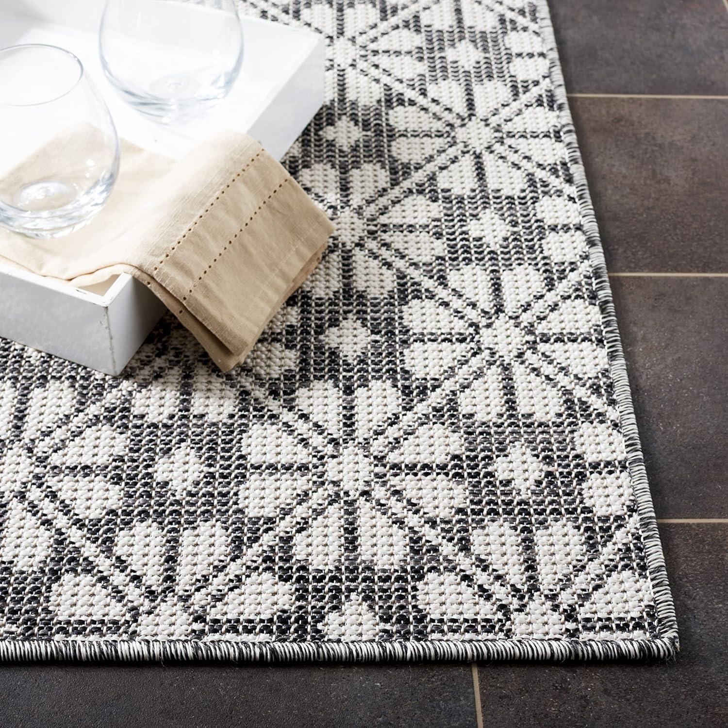 imageMartha Stewart x SAFAVIEH Outdoor Area Rug Collection 8 x 10 Black Weather Resistant amp Washable Ideal for Patio Backyard Mudroom Deck Dining Space MSR4491Z