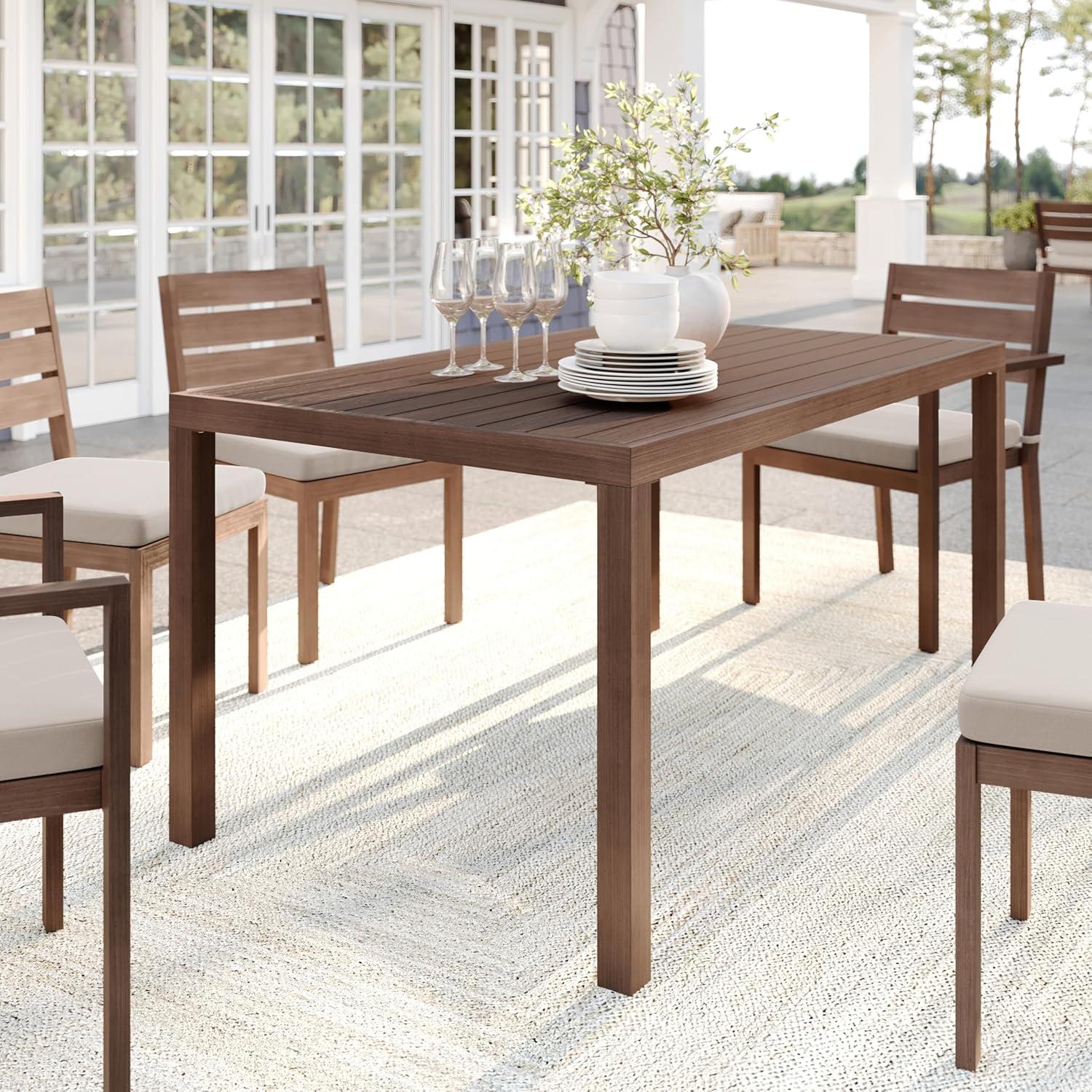 imageMartha Stewart Bedford 62 IndoorOutdoor Aluminum Patio Table with Umbrella Hole and Brushed Woodgrain Finish in BrownBrown