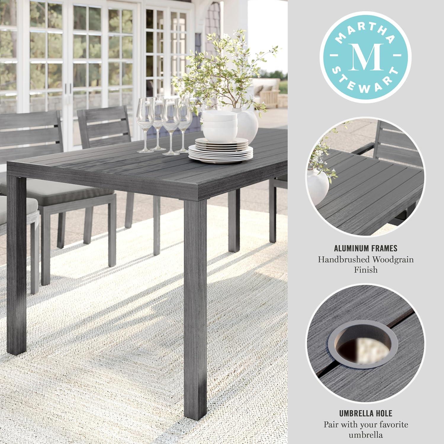 imageMartha Stewart Bedford 62 IndoorOutdoor Aluminum Patio Table with Umbrella Hole and Brushed Woodgrain Finish in BrownGrey