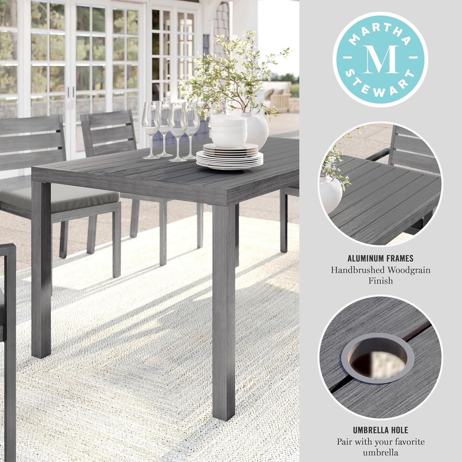 imageMartha Stewart Bedford 62 IndoorOutdoor Aluminum Patio Table with Umbrella Hole and Brushed Woodgrain Finish in BrownGrey
