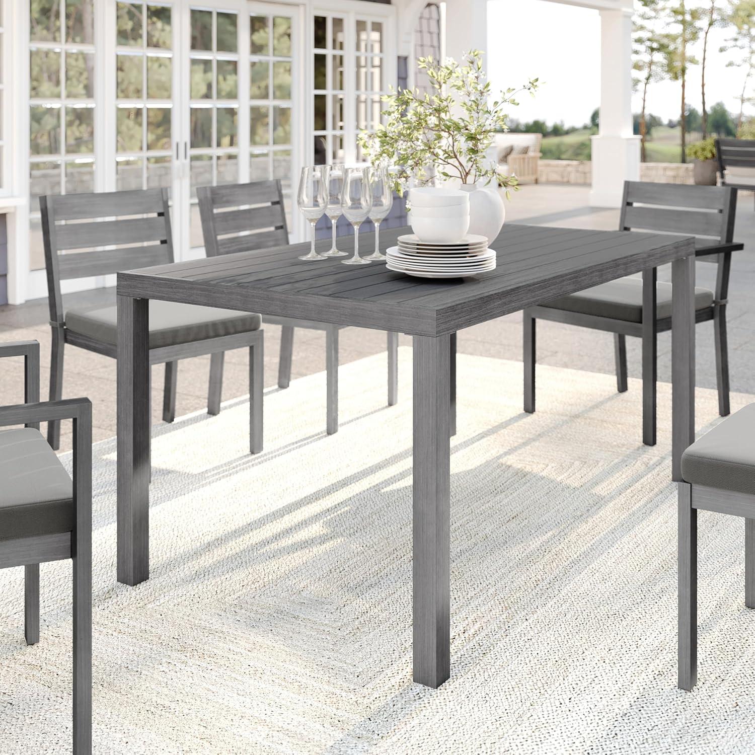 imageMartha Stewart Bedford 62 IndoorOutdoor Aluminum Patio Table with Umbrella Hole and Brushed Woodgrain Finish in BrownGrey
