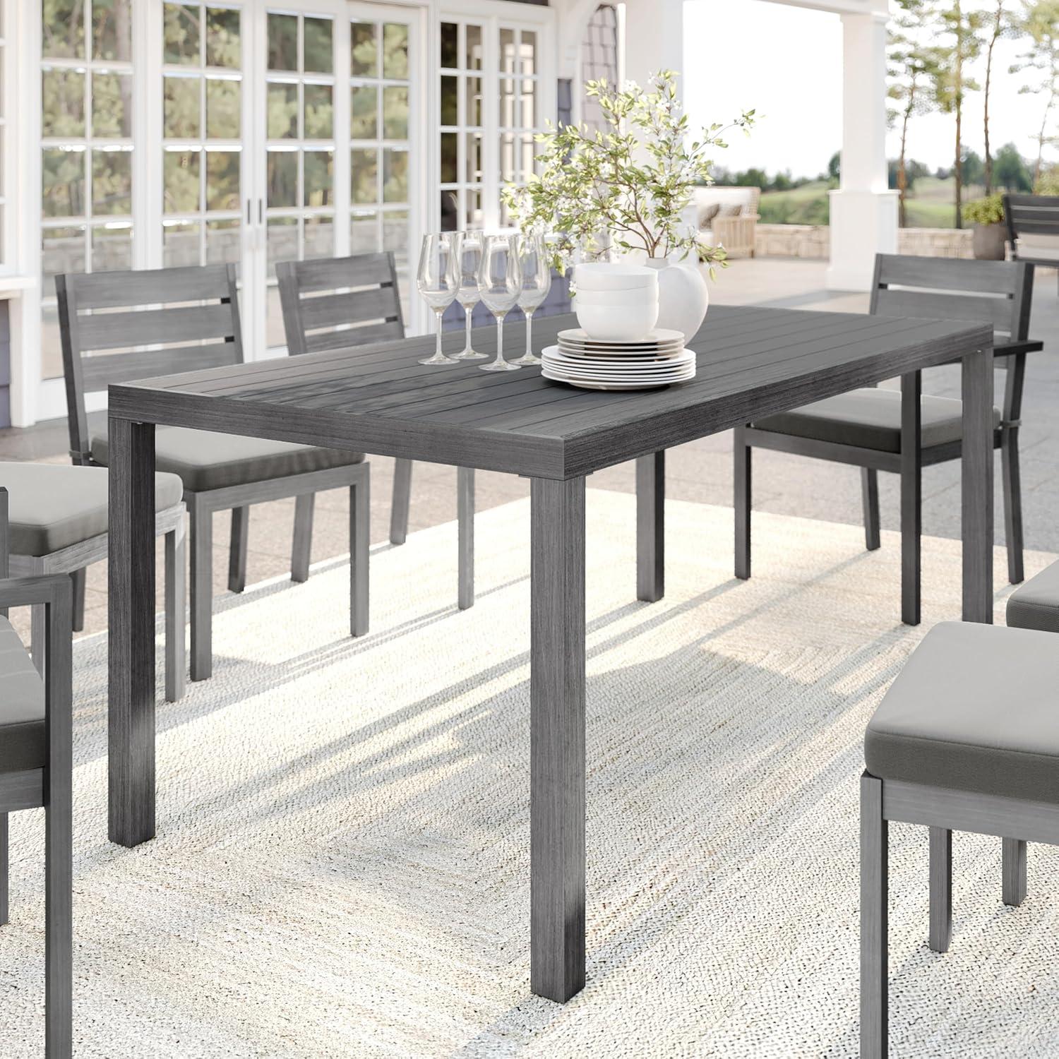 imageMartha Stewart Bedford 62 IndoorOutdoor Aluminum Patio Table with Umbrella Hole and Brushed Woodgrain Finish in BrownGrey