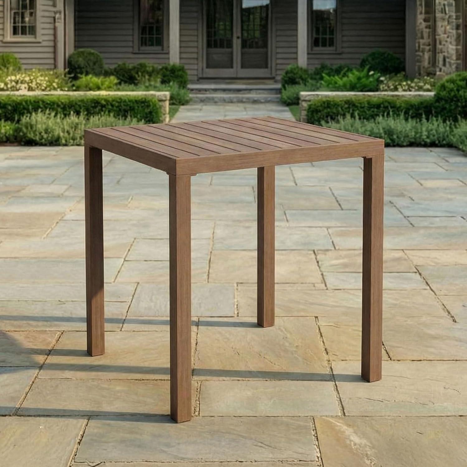 imageMartha Stewart Bedford 355 Square Bar Height Patio Table with Trestle Base IndoorOutdoor Aluminum Dining Table with Seating for 4 Brushed Gray Woodgrain FinishBrown